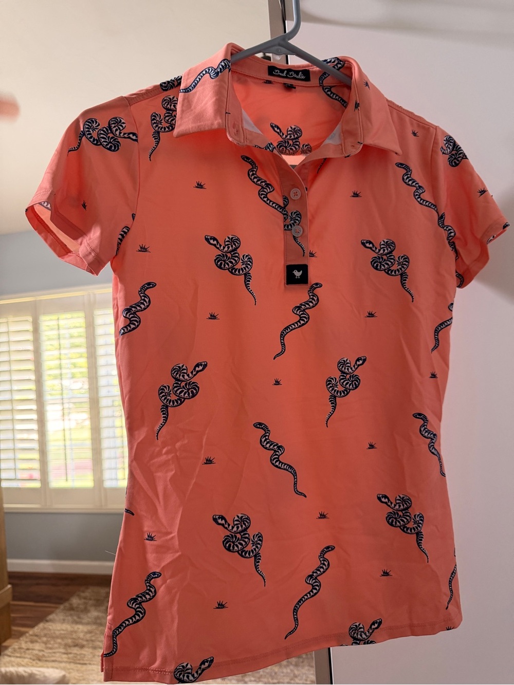 Bad Birdie Coral Polo with Navy Snake Print